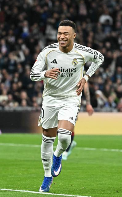 Real Madrid's French forward #10 Kylian Mbappe celebrates scoring the opening goal during the Spanish league football match between Real Madrid CF and Levante UD at Santiago Bernabeu Stadium in Madrid on January 17, 2026. (Photo by Javier SORIANO / AFP)