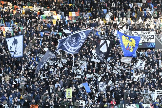 Udinese supporters cheer during the Italian Serie A football match between Udinese and Inter Milan at the Friuli stadium in Udine on January 17, 2026. (Photo by ANDREA PATTARO / AFP)