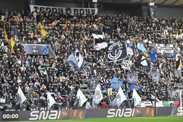 Udinese supporters cheer during the Italian Serie A football match between Udinese and Inter Milan at the Friuli stadium in Udine on January 17, 2026. (Photo by ANDREA PATTARO / AFP)