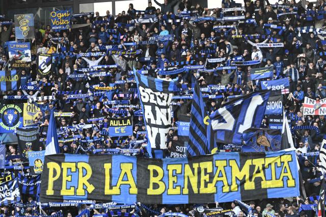Inter Milan's supporters cheer during the Italian Serie A football match between Udinese and Inter Milan at the Friuli stadium in Udine on January 17, 2026. (Photo by ANDREA PATTARO / AFP)