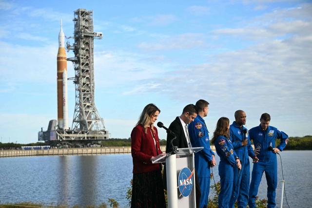 Artemis II pilot Victor Glover speaks next to, mission Commander Reid Wiseman, mission specialists Christina Koch, Jeremy Hansen and NASA Administrator Jared Isaacman during the rollout of NASA's next-generation moon rocket, the Space Launch System (SLS) rocket with the Orion crew capsule, to the launch pad at the Kennedy Space Center in Cape Canaveral, Florida, U.S., January 17, 2026. Launch around the moon and back is scheduled for no earlier than February 6, 2026. (Photo by Jim WATSON / AFP)