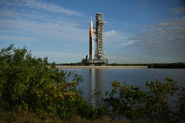 NASA's Artemis II Space Launch System rocket and Orion spacecraft are rolled out of the Vehicle Assembly Building to Launch Pad 39B at Kennedy Space Center in Florida on January 17, 2026, ahead of the crewed lunar mission. (Photo by Jim WATSON / AFP)