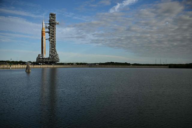NASA's Artemis II Space Launch System rocket and Orion spacecraft are rolled out of the Vehicle Assembly Building to Launch Pad 39B at Kennedy Space Center in Florida on January 17, 2026, ahead of the crewed lunar mission. (Photo by Jim WATSON / AFP)