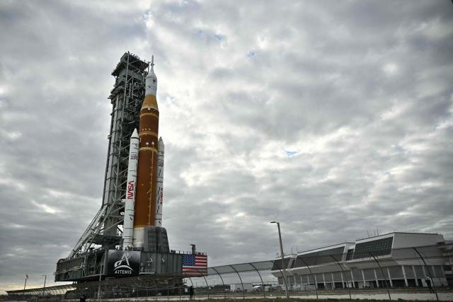 NASA's Artemis II Space Launch System rocket and Orion spacecraft are rolled out of the Vehicle Assembly Building to Launch Pad 39B at Kennedy Space Center in Florida on January 17, 2026, ahead of the crewed lunar mission. (Photo by Jim WATSON / AFP)