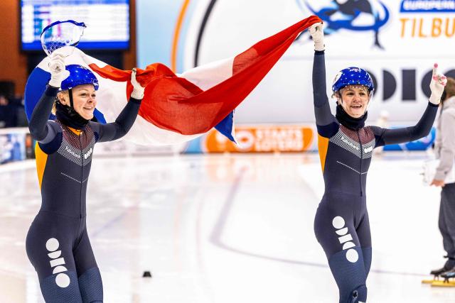 Dutch Michelle Velzeboer (L) and Dutch Xandra Velzeboer celebrate after winning the 1000-meter semi-final on the second day of the European Short Track Speed Skating Championships in Tilburg on January 17, 2026. This European Championship is a final test for the short track speed skaters ahead of the Olympic Games in Milan. (Photo by Iris van den Broek / ANP / AFP) / Netherlands OUT