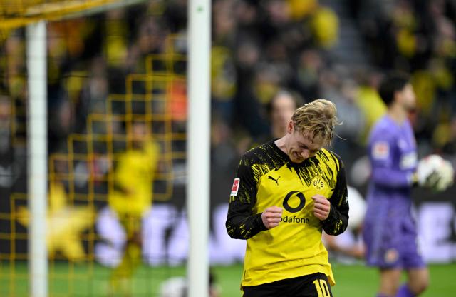 Dortmund's German midfielder #10 Julian Brandt celebrates after scoring the 1-0 goal during the German first division Bundesliga football match between BVB Borussia Dortmund and FC St Pauli in Dortmund, western Germany, on January 17, 2026. (Photo by INA FASSBENDER / AFP) / DFL REGULATIONS PROHIBIT ANY USE OF PHOTOGRAPHS AS IMAGE SEQUENCES AND/OR QUASI-VIDEO