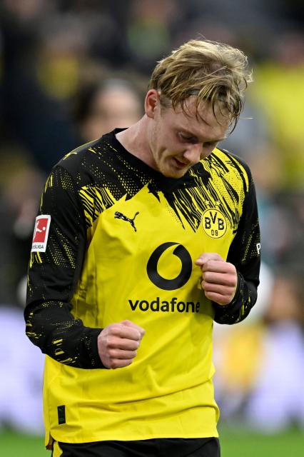 Dortmund's German midfielder #10 Julian Brandt celebrates after scoring the 1-0 goal during the German first division Bundesliga football match between BVB Borussia Dortmund and FC St Pauli in Dortmund, western Germany, on January 17, 2026. (Photo by INA FASSBENDER / AFP) / DFL REGULATIONS PROHIBIT ANY USE OF PHOTOGRAPHS AS IMAGE SEQUENCES AND/OR QUASI-VIDEO
