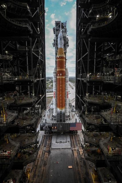 NASA's Artemis II Space Launch System rocket and Orion spacecraft are rolled out of the Vehicle Assembly Building to Launch Pad 39B at Kennedy Space Center in Florida on January 17, 2026, ahead of the crewed lunar mission. (Photo by Jim WATSON / AFP)