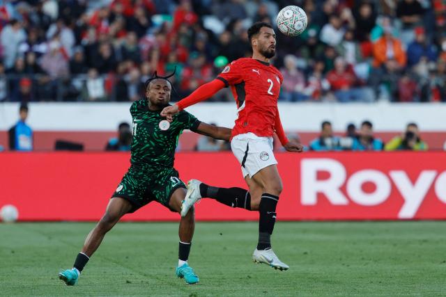 Nigeria's forward #11 Samuel Chukwueze challenges Egypt's defender #2 Khaled Sobhi during the Africa Cup of Nations (CAN) third place football match between Egypt and Nigeria at the Mohammed V Stadium in Casablanca on January 17, 2026. (Photo by Abdel Majid BZIOUAT / AFP)