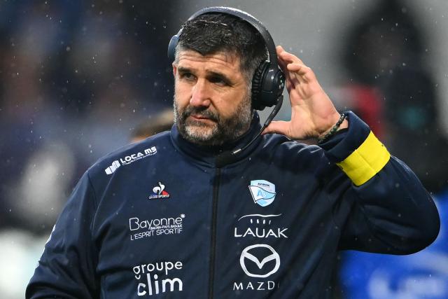 Bayonne's French head coach Gregory Patat watches his players during the European Champions Cup pool 3, round 4, rugby union match between Aviron Bayonnais (Bayonne) and Leinster Rugby at the Jean Dauger Stadium in Bayonne, southwestern France, on January 17, 2026. (Photo by GAIZKA IROZ / AFP)