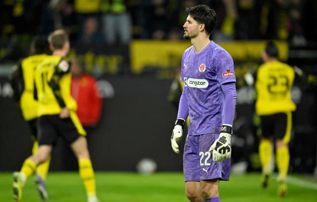 St Pauli's Bosnian goalkeeper #22 Nikola Vasilj is pictured after Dortmund scored the 3-2 goal during the German first division Bundesliga football match between BVB Borussia Dortmund and FC St Pauli in Dortmund, western Germany, on January 17, 2026. (Photo by INA FASSBENDER / AFP) / DFL REGULATIONS PROHIBIT ANY USE OF PHOTOGRAPHS AS IMAGE SEQUENCES AND/OR QUASI-VIDEO