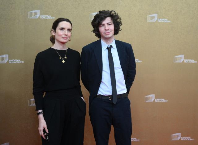 French film producer Sophie Mas and French director and illustrator Ugo Bienvenu arrive for the European Film Awards on January 17, 2026 in Berlin. (Photo by RALF HIRSCHBERGER / AFP)