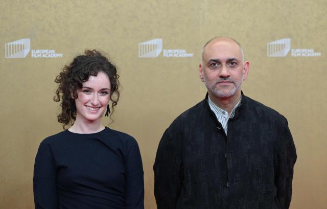 Film producer Flavia Mazzarino and Palestinian filmmaker Kamal Aljafari arrive for the European Film Awards on January 17, 2026 in Berlin. (Photo by RALF HIRSCHBERGER / AFP)