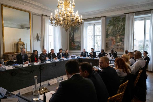 French President's Overseas councillor Olivier Jacob (L), France's Overseas Minister Naima Moutchou (2nd-L), French Ministry of Overseas' chief of staff Laurent Prevost, High Commissioner of the Republic in New Caledonia Jacques Billant, French parliament councillors Alain Sauret (7thL) and Leo Vitry and pro-independance politicians Adolphe Digouй  (9thL), Jean-Pierre Djaiwe and Victor Tutugoro take part in a meeting with a delegation of representatives of New-Caledonia at France's Overseas Ministry in Paris on January 17, 2026. On January 16, France's President opened a new round of discussions on the institutional future of New Caledonia, stating his desire to move forward “without forcing the issue but without paralysis,” despite the absence of the main independence movement. (Photo by Martin LELIEVRE / AFP)