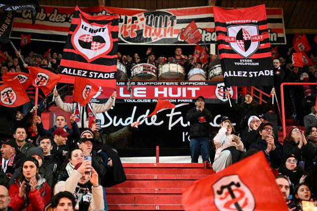 Toulouse supporters cheer on their team during the European Champions Cup pool 1, round 4, rugby union match between Stade Toulousain Rugby (Toulouse) and Sale Sharks at the Ernest Wallon Stadium in Toulouse, southwestern France, on January 17, 2026. (Photo by Lionel BONAVENTURE / AFP)