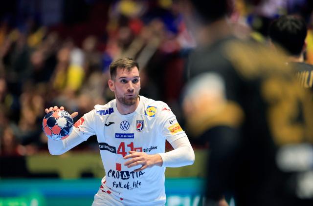 Croatia's centre back #41 Tin Lucin plays the ball during the EHF Euro 2026 group E preliminary round handball match between Croatia and Georgia in Malmo, Sweden, on January 17, 2026. (Photo by Andreas Hillergren/TT / TT News Agency / AFP) / Sweden OUT