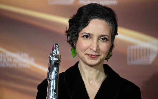 Iranian-Dutch filmmaker Sara Rajaei holds her "European Short Film – Prix Vimeo" award she was given during the European Film Awards on January 17, 2026 in Berlin. (Photo by RALF HIRSCHBERGER / AFP)