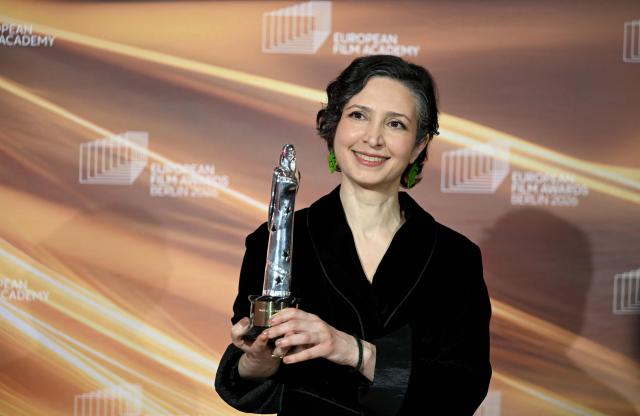 Iranian-Dutch filmmaker Sara Rajaei holds her "European Short Film – Prix Vimeo" award she was given during the European Film Awards on January 17, 2026 in Berlin. (Photo by RALF HIRSCHBERGER / AFP)