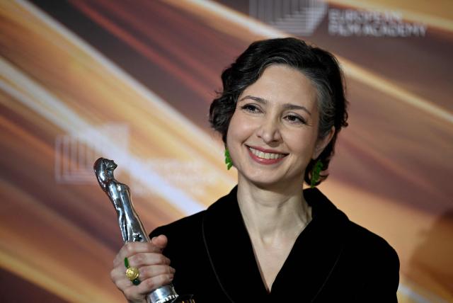 Iranian-Dutch filmmaker Sara Rajaei holds her "European Short Film – Prix Vimeo" award she was given during the European Film Awards on January 17, 2026 in Berlin. (Photo by RALF HIRSCHBERGER / AFP)