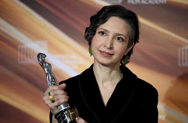 Iranian-Dutch filmmaker Sara Rajaei holds her "European Short Film – Prix Vimeo" award she was given during the European Film Awards on January 17, 2026 in Berlin. (Photo by RALF HIRSCHBERGER / AFP)