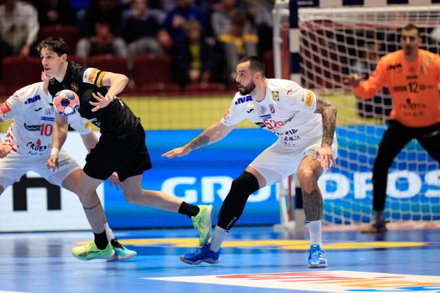 Georgia's left back #34 Miriani Gavashelishvili (L) plays the ball during the EHF Euro 2026 group E preliminary round handball match between Croatia and Georgia in Malmo, Sweden, on January 17, 2026. (Photo by Andreas Hillergren/TT / TT News Agency / AFP) / Sweden OUT