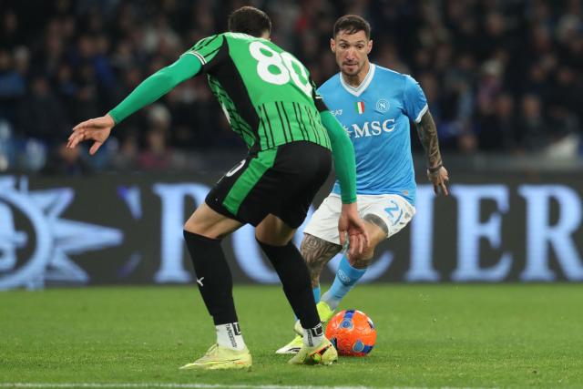 Napoli's Italian forward #21 Matteo Politano fights for the ball with Sassuolo's Bosnian defender #80 Tarik Muharemovic during the Italian Serie A football match between Napoli and Sassuolo at the Diego Armando Maradona stadium in Naples on January 17, 2026. (Photo by Carlo Hermann / AFP)