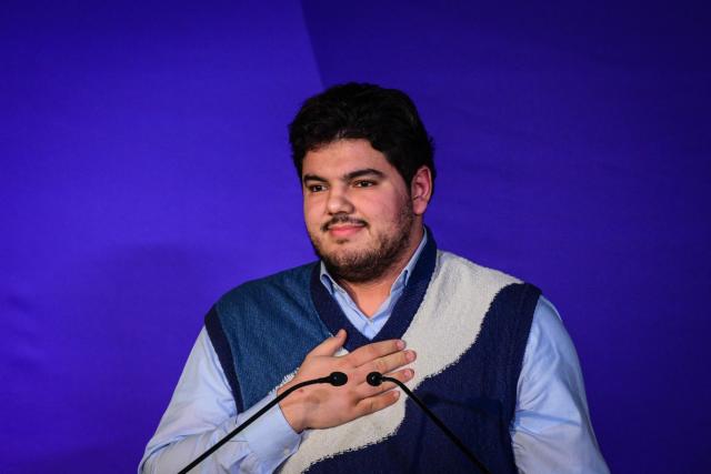 French anti-drug activist Amine Kessaci gestures as he speaks before the Mayor of Lyon and candidate Gregory Doucet during latter's campaign ahead of the 2026 municipal elections in Lyon, eastern France on January 17, 2026. (Photo by OLIVIER CHASSIGNOLE / AFP)