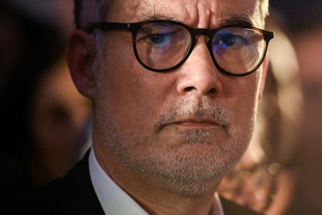 (FILES) First Secretary of the Socialist Party and Socialistes et Apparentes' MP Olivier Faure attends a meeting of the united left at La Bellevilloise in Paris on January 14, 2026. The Socialist Party will not censure the government if the “victories achieved” with Prime Minister's announcements the day before “are not financed at the expense of the French people,” said its First Secretary Olivier Faure on January 17, 2026. (Photo by Martin LELIEVRE / AFP)