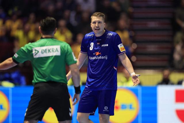 Netherlands' centre back #03 Ivar Stavast (R) reacts to the referee during the EHF Euro 2026 group E preliminary round handball match between Sweden and The Netherlands in Malmo, Sweden, on January 17, 2026. (Photo by Andreas Hillergren/TT / TT News Agency / AFP) / Sweden OUT