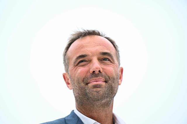 (FILES) Mayor of Montpellier and President of Montpellier Mediterranee Metropole, Michael Delafosse, attends a representation of "Echo de Rue", as part of the 45th Montpellier Danse Festival closing show at the Place de la Comedie in Montpellier, southern France, on July 5, 2025. Elected as an “outsider” in 2020, the socialist mayor of Montpellier, Michael Delafosse, unsurprisingly announced his candidacy for a second term on January 17, 2026, this time presenting himself in a position of strength against fragmented opposition on the and right. (Photo by GABRIEL BOUYS / AFP)