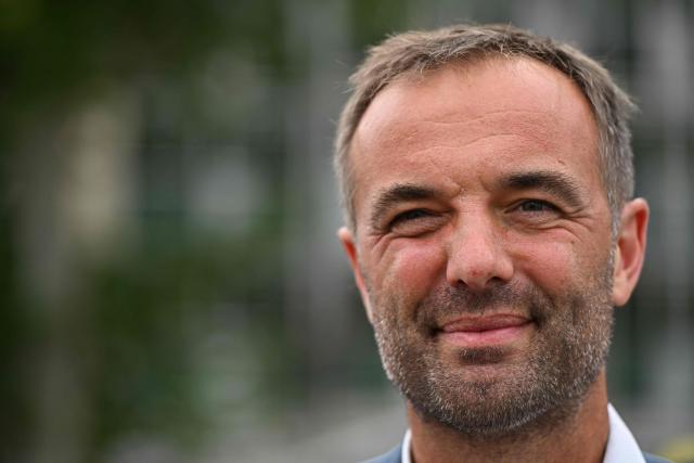 (FILES) Mayor of Montpellier and President of Montpellier Mediterranee Metropole, Michael Delafosse, poses during a representation of "Echo de Rue", as part of the 45th Montpellier Danse Festival closing show at the Place de la Comedie in Montpellier, southern France, on July 5, 2025. Elected as an “outsider” in 2020, the socialist mayor of Montpellier, Michael Delafosse, unsurprisingly announced his candidacy for a second term on January 17, 2026, this time presenting himself in a position of strength against fragmented opposition on the and right. (Photo by GABRIEL BOUYS / AFP)
