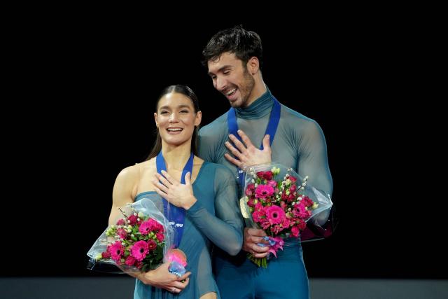 France's Laurence Fournier Beaudry and Guillaume Cizeron sing the French national anthem on the podium after their victory in the Ice Dance Free Dance on the final day of the ISU Figure Ice Skating European Championships in Sheffield, northern England on January 17, 2026. (Photo by Ian HODGSON / AFP)
