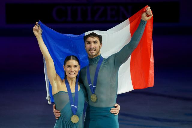 France's Laurence Fournier Beaudry and Guillaume Cizeron pose for a photo after their victory in the Ice Dance Free Dance on the final day of the ISU Figure Ice Skating European Championships in Sheffield, northern England on January 17, 2026. (Photo by Ian HODGSON / AFP)