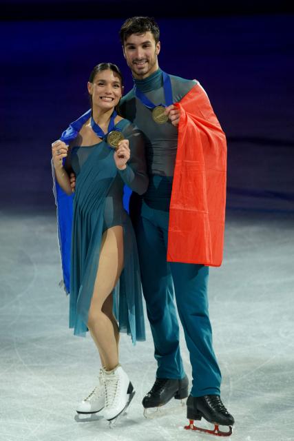 France's Laurence Fournier Beaudry and Guillaume Cizeron pose for a photo after their victory in the Ice Dance Free Dance on the final day of the ISU Figure Ice Skating European Championships in Sheffield, northern England on January 17, 2026. (Photo by Ian HODGSON / AFP)
