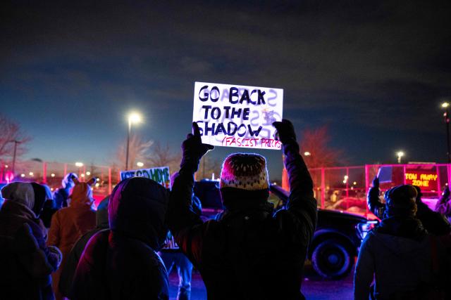 A protester holds up a sign during an anti-US Immigration and Customs Enforcement (ICE) protest in front of the Bishop Henry Whipple Federal Building in Minneapolis, Minnesota on January 17, 2026. A US judge restricted federal agents on January 16 from interfering with peaceful protesters in Minnesota, after President Donald Trump said there was no immediate need to invoke the Insurrection Act over the demonstrations. (Photo by ROBERTO SCHMIDT / AFP)