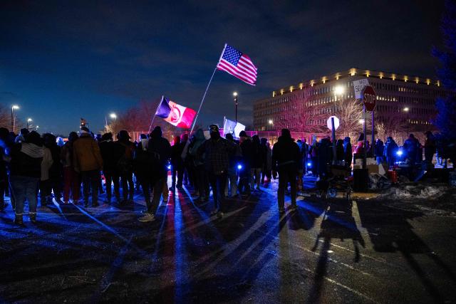 Protesters hold flags during an anti-US Immigration and Customs Enforcement (ICE) protest in front of the Bishop Henry Whipple Federal Building in Minneapolis, Minnesota on January 17, 2026. A US judge restricted federal agents on January 16 from interfering with peaceful protesters in Minnesota, after President Donald Trump said there was no immediate need to invoke the Insurrection Act over the demonstrations. (Photo by ROBERTO SCHMIDT / AFP)