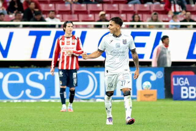 Queretaro's Argentine forward #37 Mateo Coronel celebrates scoring his team's first goal during the Liga MX Clausura football match between Guadalajara and Queretaro at the Akron Stadium in Zapopan, Mexico on January 17, 2026. (Photo by Ulises Ruiz / AFP)