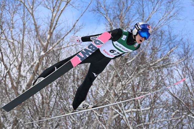Japan's Ryoyu Kobayashi performs his first jump in the individual Large Hill HS137 competition on the third day of men's FIS Ski Jumping World Cup competition in Sapporo on January 18, 2026. (Photo by Toshifumi KITAMURA / AFP)