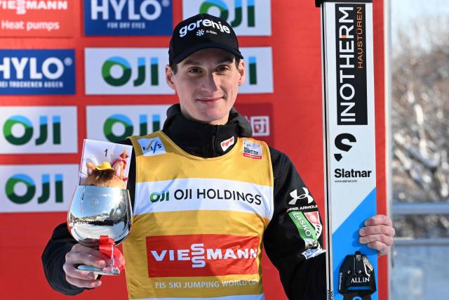 Winner Slovenia's Domen Prevc poses on the podium for the individual Large Hill HS137 competition on the third day of men's FIS Ski Jumping World Cup competition in Sapporo on January 18, 2026. (Photo by Toshifumi KITAMURA / AFP)