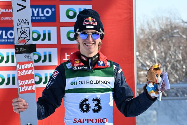 Third-placed Austria's Daniel Tschofenig poses on the podium for the individual Large Hill HS137 competition on the third day of men's FIS Ski Jumping World Cup competition in Sapporo on January 18, 2026. (Photo by Toshifumi KITAMURA / AFP)