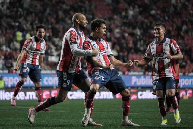 TOPSHOT - San Luis' midfielder #25 Fidel Barajas (C-R) celebrates scoring his team's first goal during the Liga MX Clausura football match between Tijuana and Atletico de San Luis at the Caliente Stadium in Tijuana, Baja California, Mexico on January 17, 2026. (Photo by Guillermo ARIAS / AFP)