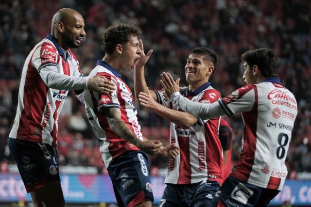 San Luis' midfielder #25 Fidel Barajas (C-L) celebrates scoring his team's first goal during the Liga MX Clausura football match between Tijuana and Atletico de San Luis at the Caliente Stadium in Tijuana, Baja California, Mexico on January 17, 2026. (Photo by Guillermo ARIAS / AFP)
