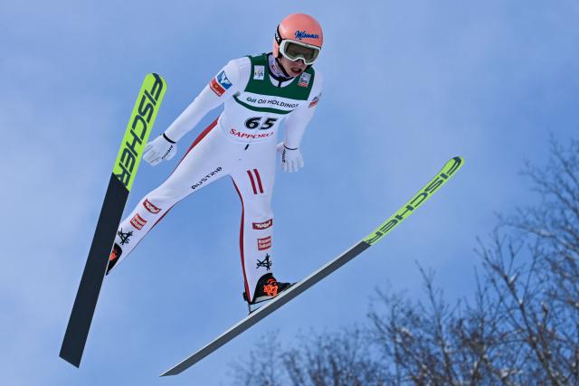 Austria's Jan Hoerl performs his first jump in the individual Large Hill HS137 competition on the third day of men's FIS Ski Jumping World Cup competition in Sapporo on January 18, 2026. (Photo by Toshifumi KITAMURA / AFP)