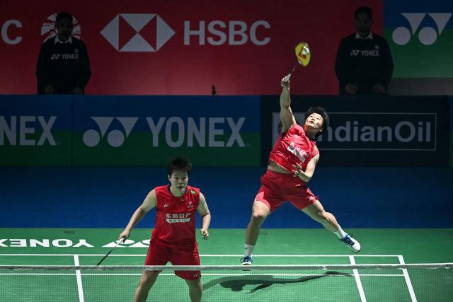 China’s Liu Sheng Shu (L) and Tan Ning (R) play a return against Japan’s Yuki Fukushima and Mayu Matsumoto during their women’s doubles final match at the India Open 2026 badminton tournament in New Delhi on January 18, 2026. (Photo by Sajjad HUSSAIN / AFP)