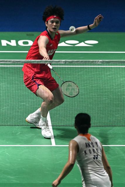 China's Wang Zhi Yi hits a return to South Korea’s An Se-young during their women's singles final match at the India Open 2026 badminton tournament in New Delhi on January 18, 2026. (Photo by Sajjad HUSSAIN / AFP)