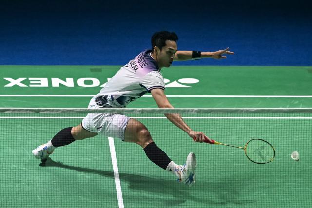 Indonesia’s Jonatan Christie hits a return during his men's singles final match against Taiwan’s Lin Chun-yi at the India Open 2026 badminton tournament in New Delhi on January 18, 2026. (Photo by Sajjad HUSSAIN / AFP)