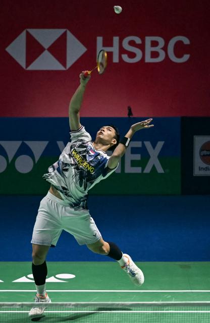 Indonesia’s Jonatan Christie hits a return during his men's singles final match against Taiwan’s Lin Chun-yi at the India Open 2026 badminton tournament in New Delhi on January 18, 2026. (Photo by Sajjad HUSSAIN / AFP)