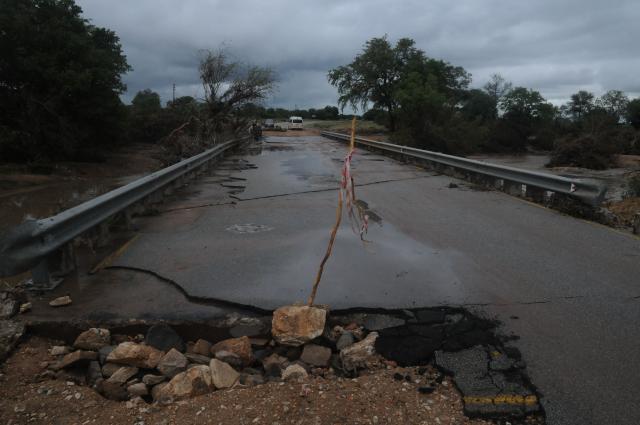 A general view of a damaged road on the way from Giyani to Mbaula on January 17, 2026 following heavy rains over much of the Limpopo Province, South Africa. Heavy rains have drenched the northeast of the country since late last year, claiming at least 30 lives. (Photo by LUCAS LEDWABA / AFP)