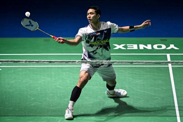 Indonesia’s Jonatan Christie hits a return during his men's singles final match against Taiwan’s Lin Chun-yi at the India Open 2026 badminton tournament in New Delhi on January 18, 2026. (Photo by Sajjad HUSSAIN / AFP)