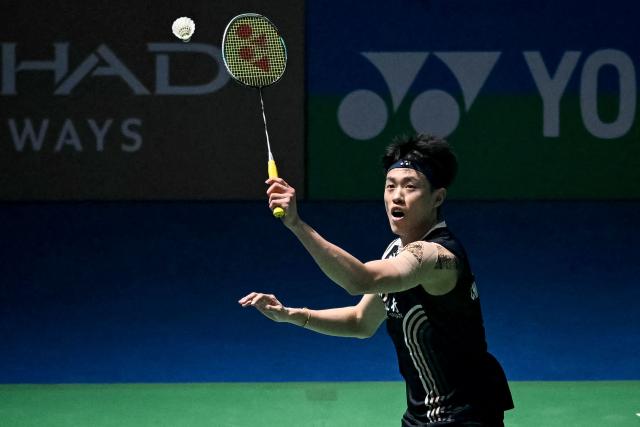 Taiwan’s Lin Chun-yi hits a return during his men's singles final match against Indonesia’s Jonatan Christie at the India Open 2026 badminton tournament in New Delhi on January 18, 2026. (Photo by Sajjad HUSSAIN / AFP)